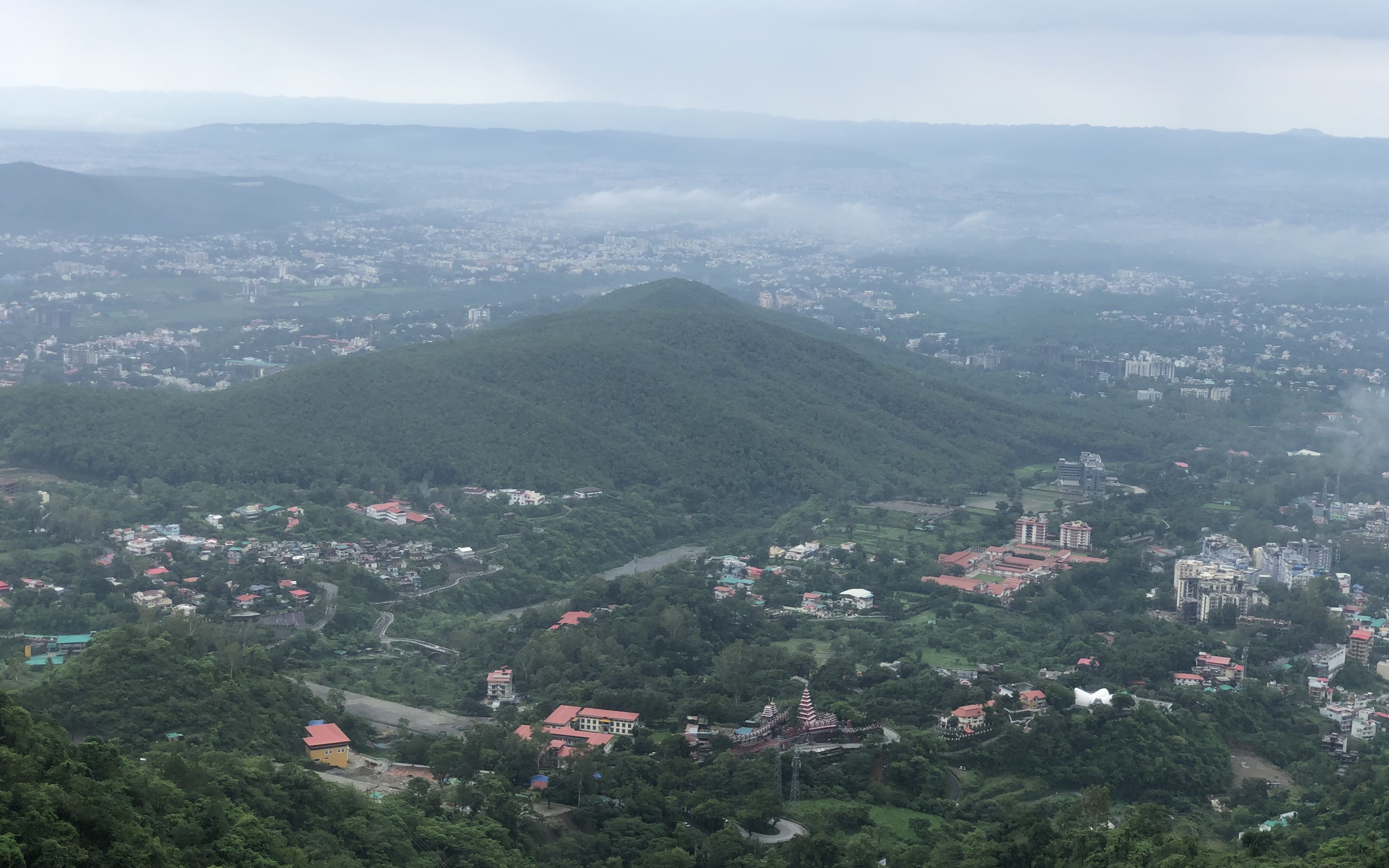 Sura Hill with its lush green sal forests. The temple of Sura Devi is situated deep inside the forest.