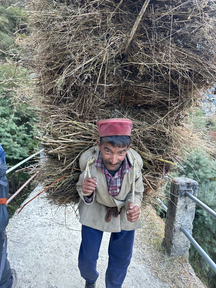 resident of the Har Ki Doon valley. Carrying fodder for animals. Life is tough in the hills but people carry a happy face. Har ki Doon trek is located in district Uttarkashi, Uttarakhand. #treksinUttarakhand