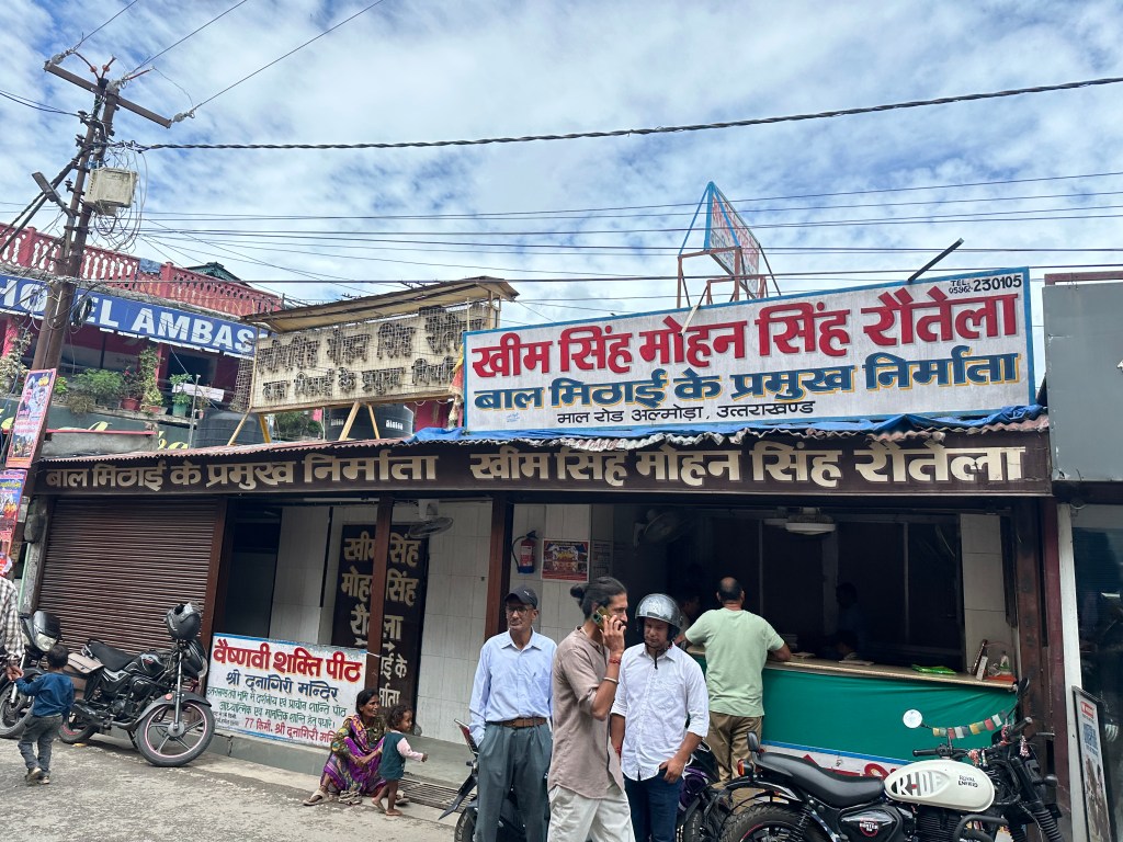 Kheem Singh Mohan Singh Rautela, the shop that has popularized Bal Mithai, the signature sweet of Almora. #cuisinesofAlmora #culinarytrail #Uttarakhandcuisine #sweetshop #visitAlmora #foodtourAlmora #incredible #mouthwatering #pahad #Balmithai