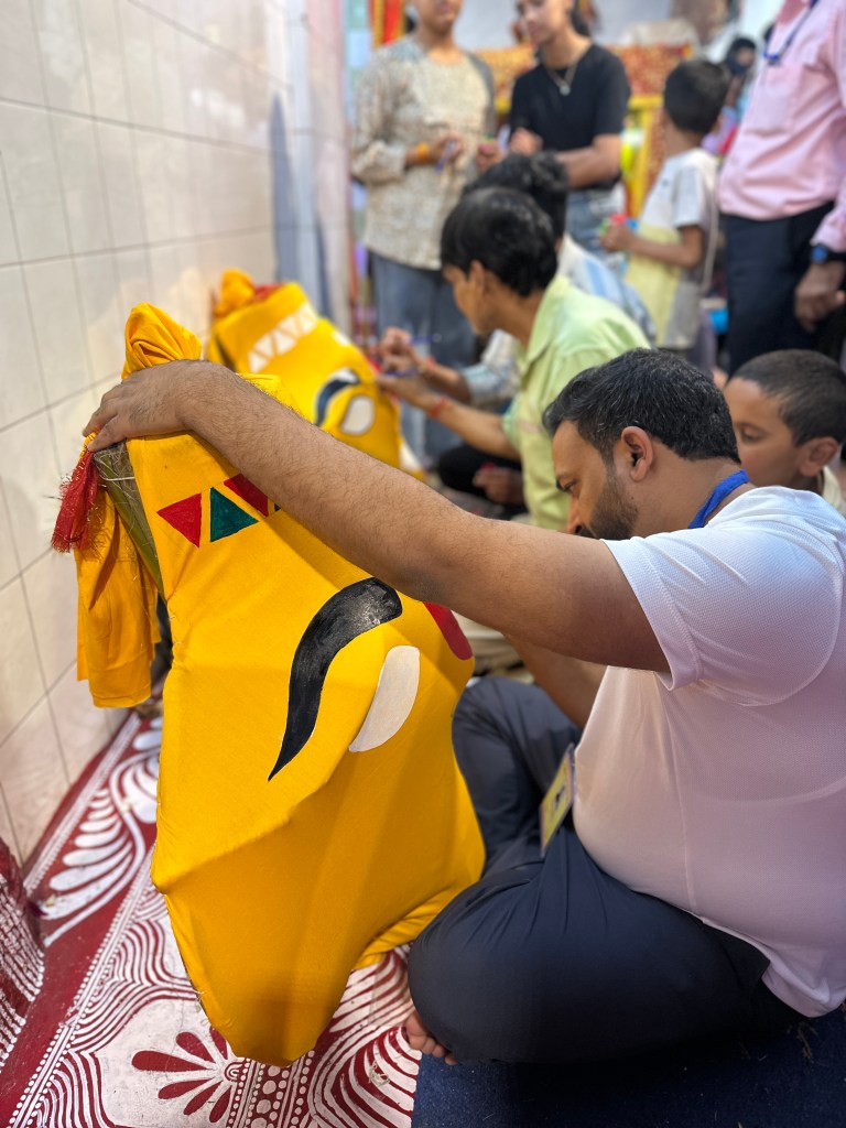 The artists beautifully craft the faces of the two goddesses, using a rich palette of colours and carefully chosen shapes — each carrying its own meaning and significance. #folkart #idolmaking #ageoldtraditions #nandadevimahotsav #almorafestivals #festivalsofUttarakhand #NandaSunanda #Devbhoomi