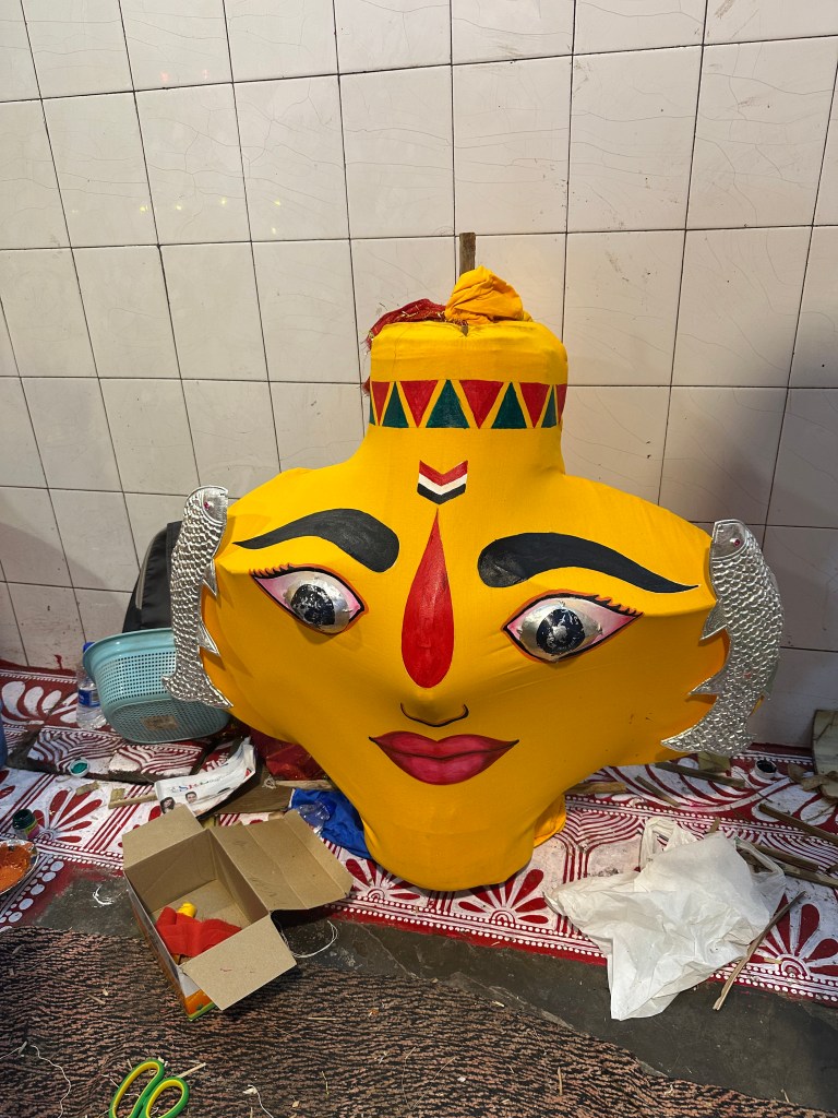 The artists beautifully craft the faces of the two goddesses, using a rich palette of colours and carefully chosen shapes — each carrying its own meaning and significance. #folkart #idolmaking #ageoldtraditions #nandadevimahotsav #almorafestivals #festivalsofUttarakhand #NandaSunanda #Devbhoomi