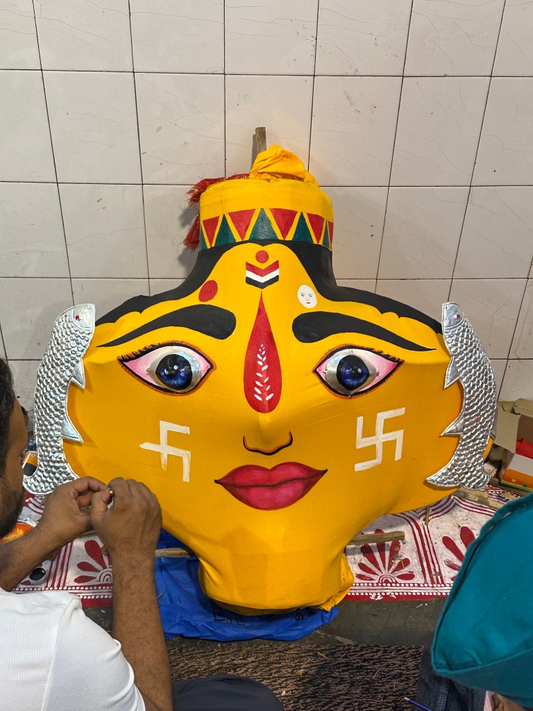 Final touches being added by the artist as the elaborate face of the Goddess takes clearer shape, preparing to be placed in its palanquin alongside her twin sister.
#NandaSunanda #NandaDeviMahotsav #KumaoniCulture #Tradition #Devbhoomi #TraditionsOfKumaon #AlmoraFestival #FestivalsOfKumaon #UttarakhandCulture