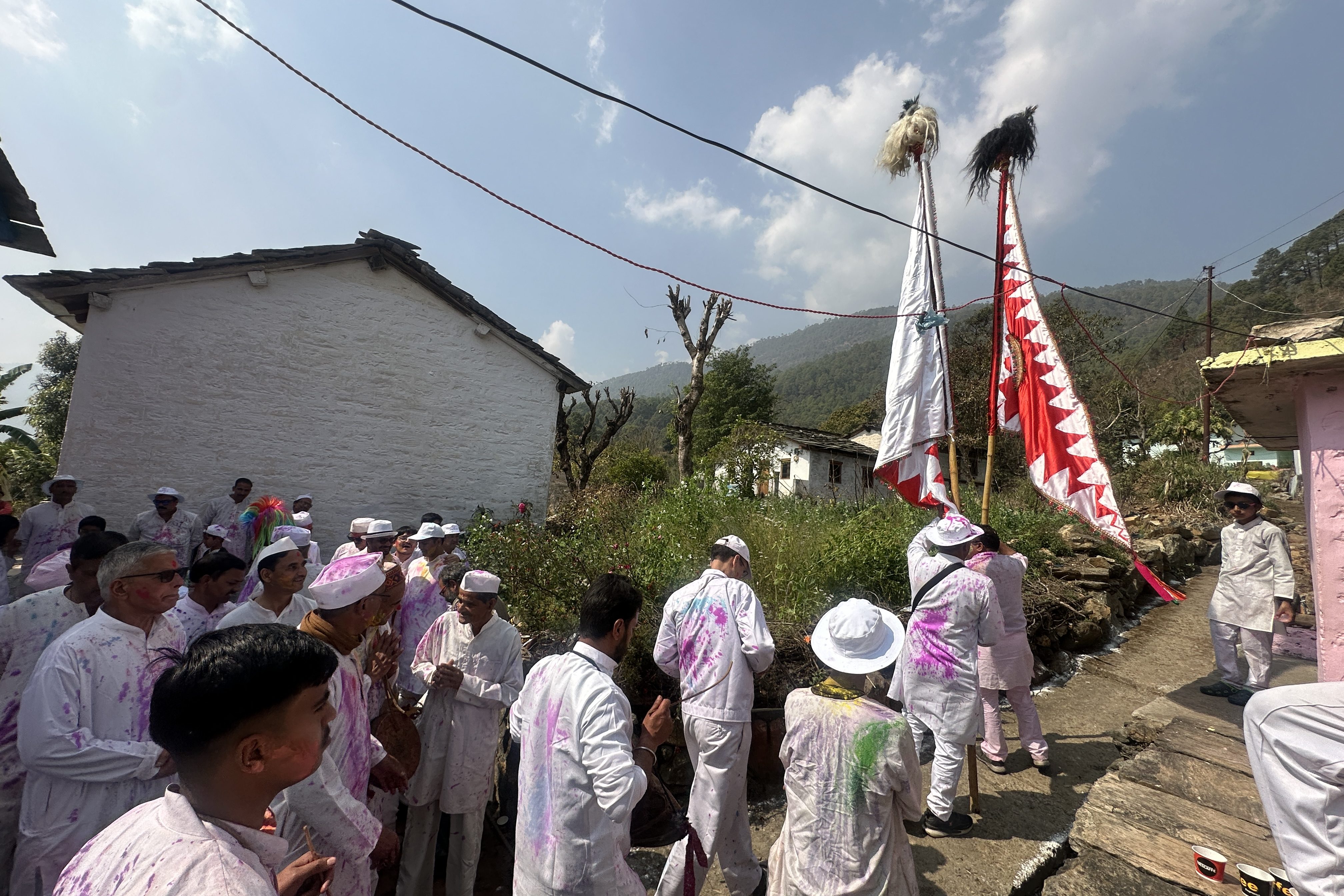 Villagers walk together through Barsayat village, carrying the Nishan from one household to another as part of the Kumaoni Holi tradition, with homes opening their doors to prayers, songs, and shared celebration. #holitime #kumaoniholi #Maabhagwati #LordHanuman #Berinag #Pithoragarh #Uttarakhand #pahadilife #Uttarakhandculture #villagelife #kumaoniculture #traditionalholi #incredibleIndia