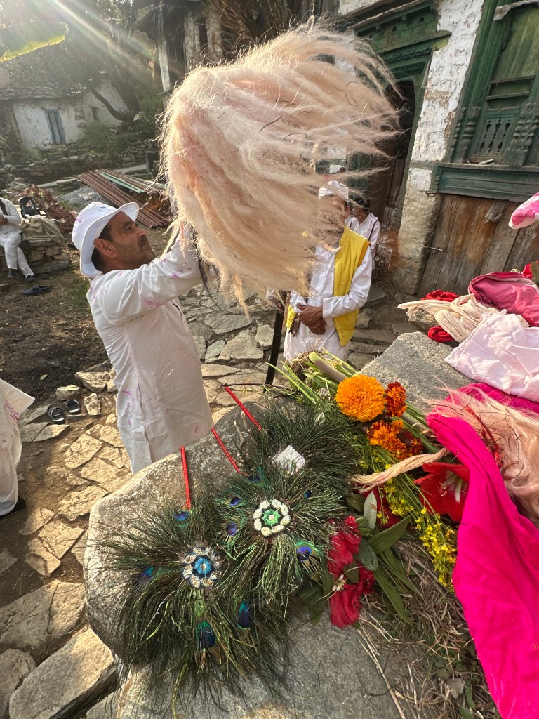 Nishan in the making. the wooden staff being adorned with ornaments, flowers of the season. Also draped with sacred cloth, symbolizing Maa Bhagwati and Lord Hanuman. Preparation taking place at Bana village, Berinag block, district Pithoragraph, Uttarakhand #Kumaoniholi #Uttarakhandculture #devbhoomiuttarakhand #pahadilife #culturalheritage #villagefestivals #nishanmaking #holitime #pahadiholi #mountainlife